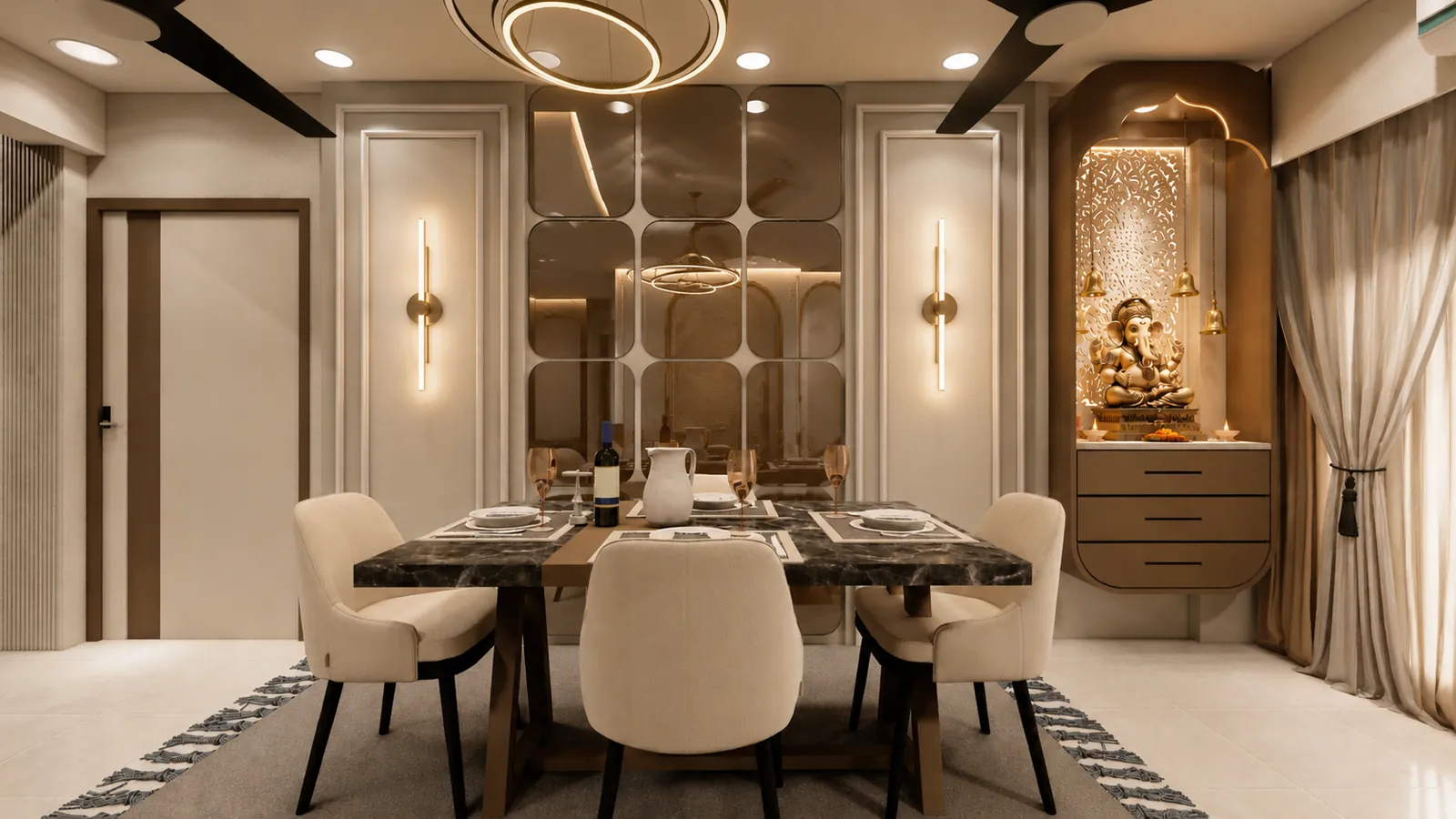 A dining area with a marble-topped table, cream chairs, a mirrored feature wall, wall lights and a pooja niche